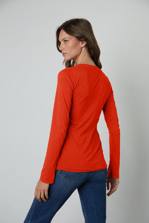 the back view of a woman wearing a Velvet by Graham & Spencer ZOFINA GAUZY WHISPER FITTED CREW NECK TEE.