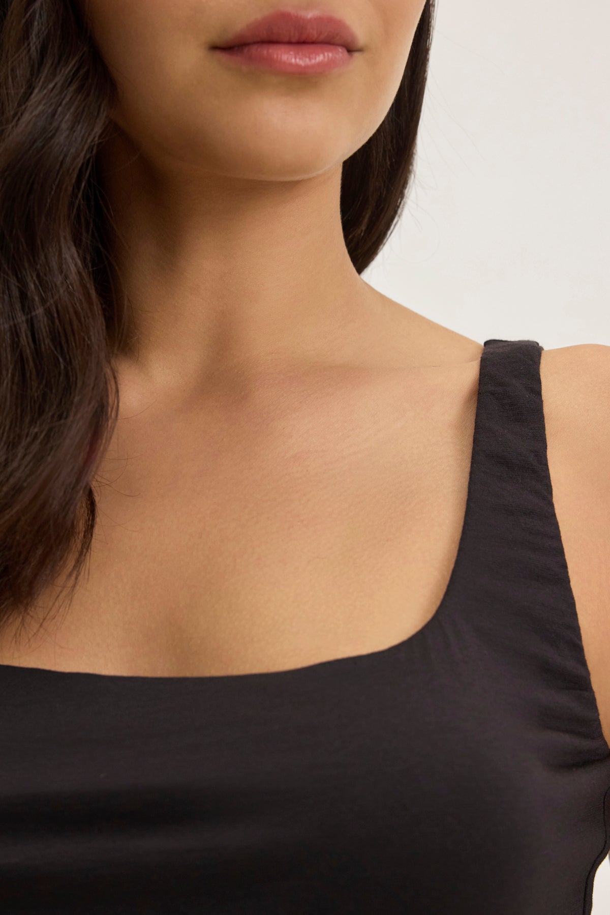 A person is seen wearing the MELANI TANK TOP by Velvet by Graham & Spencer. Their dark hair partially shows against a plain background.-38957715685569