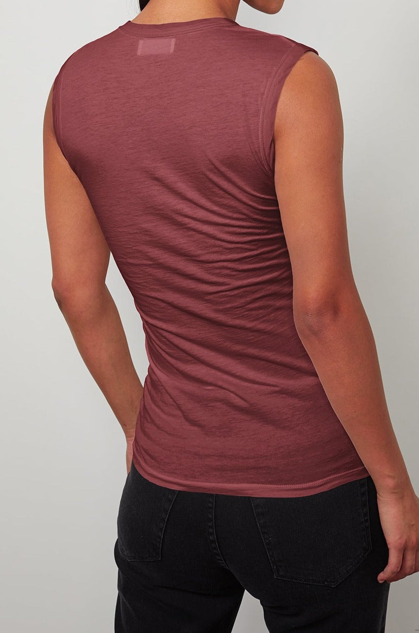   The back view of a woman wearing a Velvet by Graham & Spencer ESTINA GAUZY WHISPER FITTED TANK TOP. 