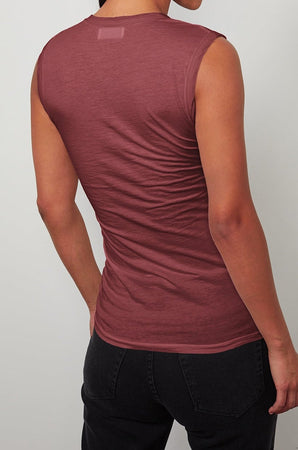 The back view of a woman wearing a Velvet by Graham & Spencer ESTINA GAUZY WHISPER FITTED TANK TOP.