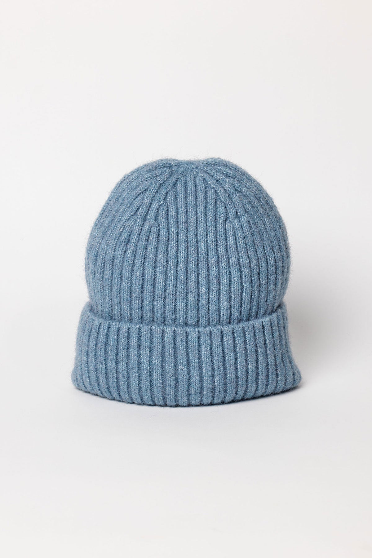 The KEY BEANIE by Velvet by Graham & Spencer is a light blue knit hat with a folded brim, shown upright on a plain white background.