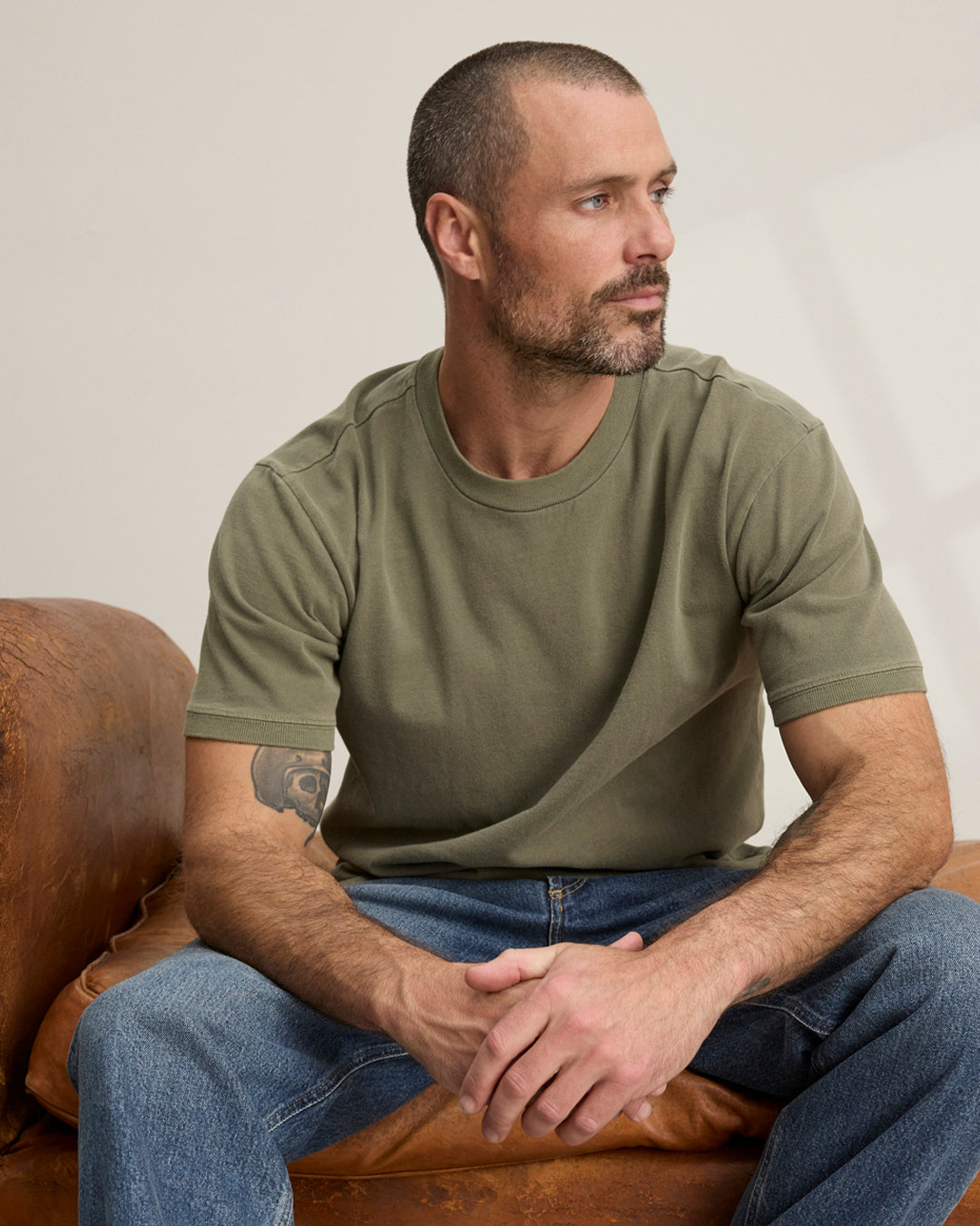 A man wearing the Elias Tee in Cactus by Velvet by Graham & Spencer.
