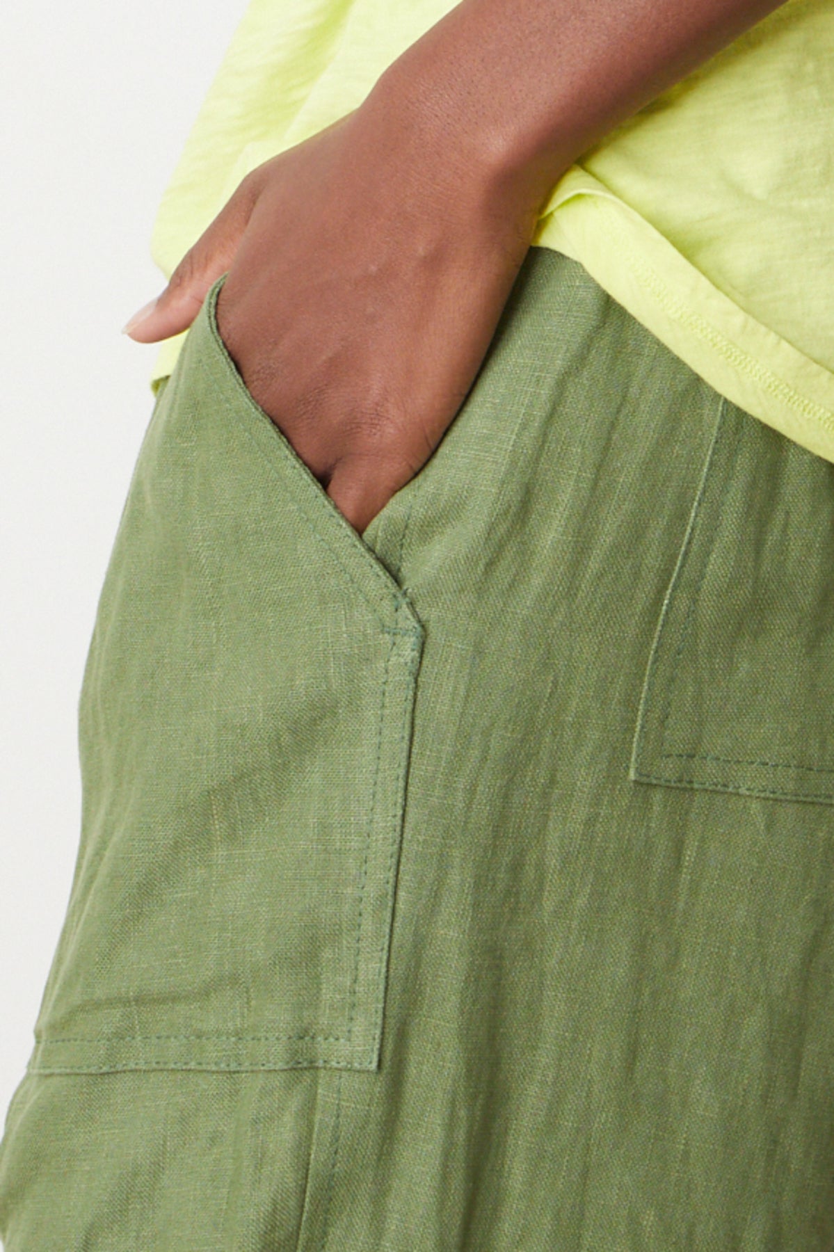 CINDY HEAVY LINEN PANT by Velvet by Graham & Spencer in basil green close up of hand in pocket-26757363990721