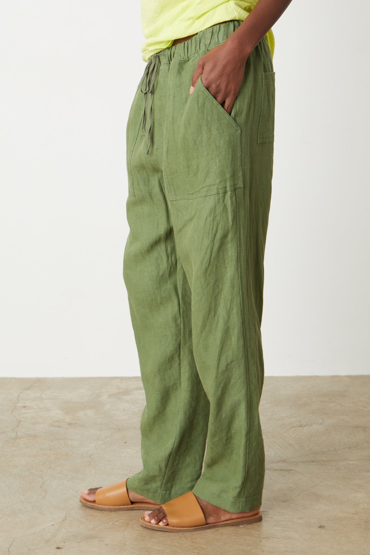 A woman wearing Velvet by Graham & Spencer's CINDY HEAVY LINEN PANT and a yellow t - shirt.-26757363957953