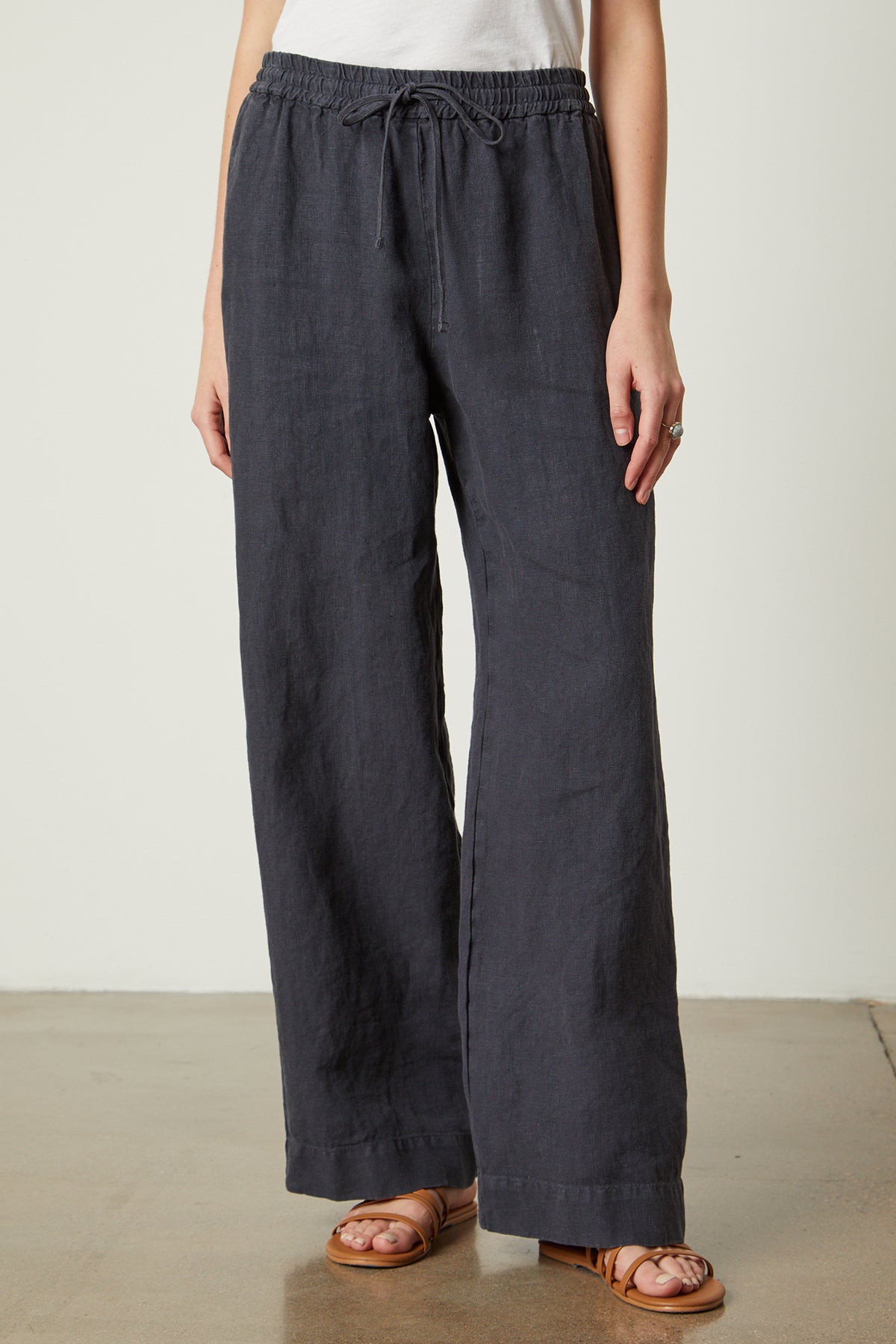 a woman wearing a pair of Velvet by Graham & Spencer GWYNETH HEAVY LINEN PANT.-35954253463745