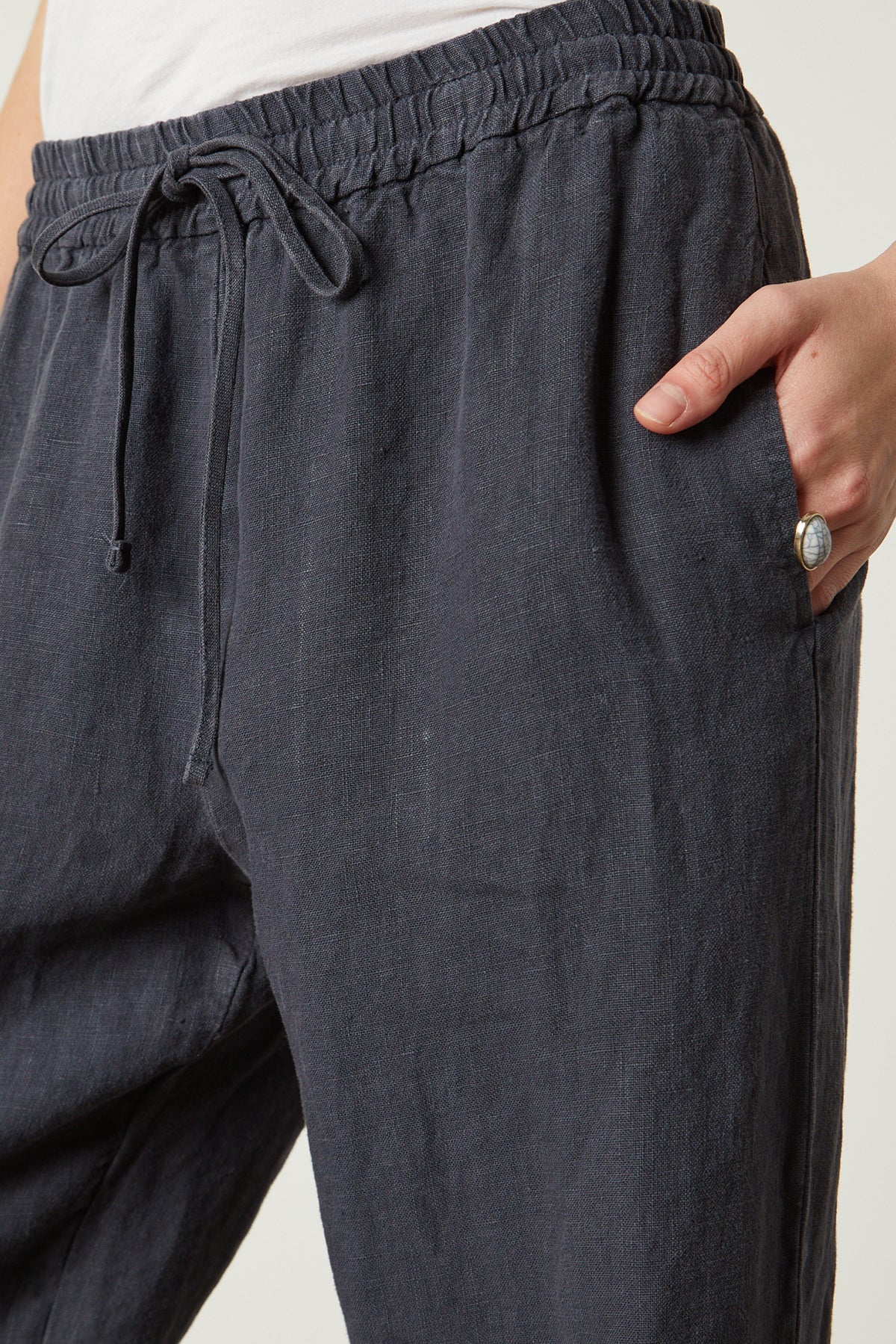   A woman is wearing a pair of GWYNETH HEAVY LINEN PANT pants by Velvet by Graham & Spencer. 