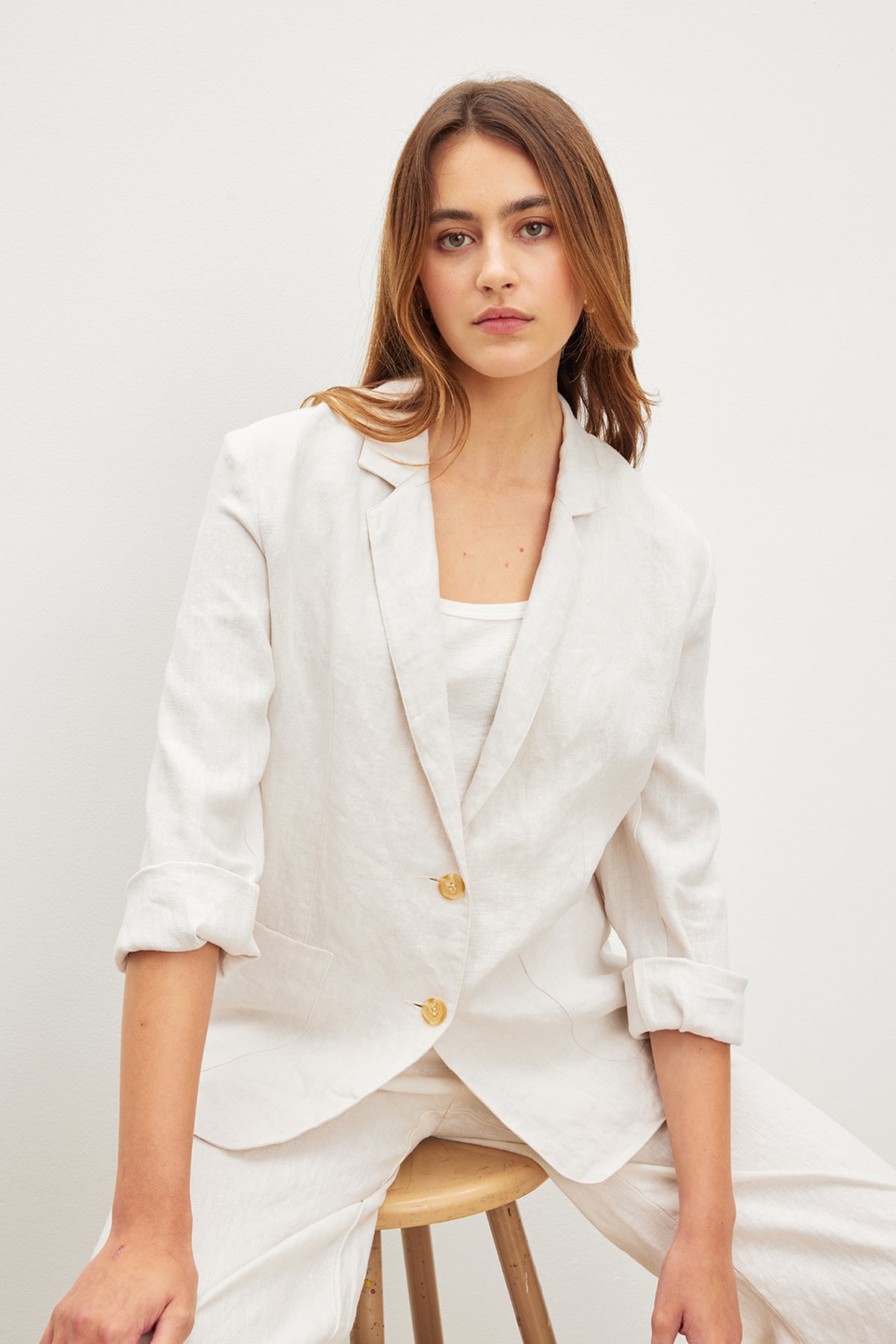   The model is wearing the LENNY HEAVY LINEN BLAZER by Velvet by Graham & Spencer. 