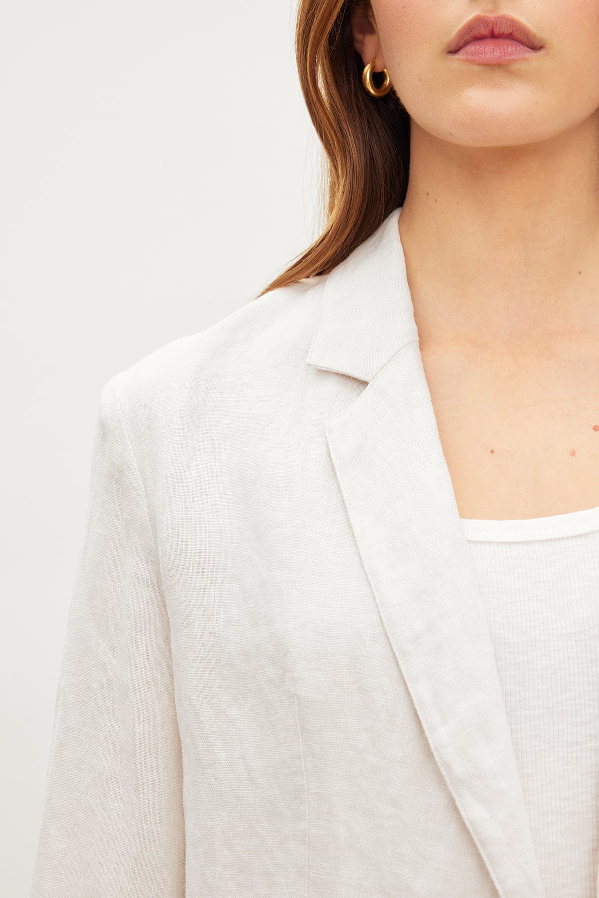   A woman wearing a Velvet by Graham & Spencer Lenny Heavy Linen Blazer. 