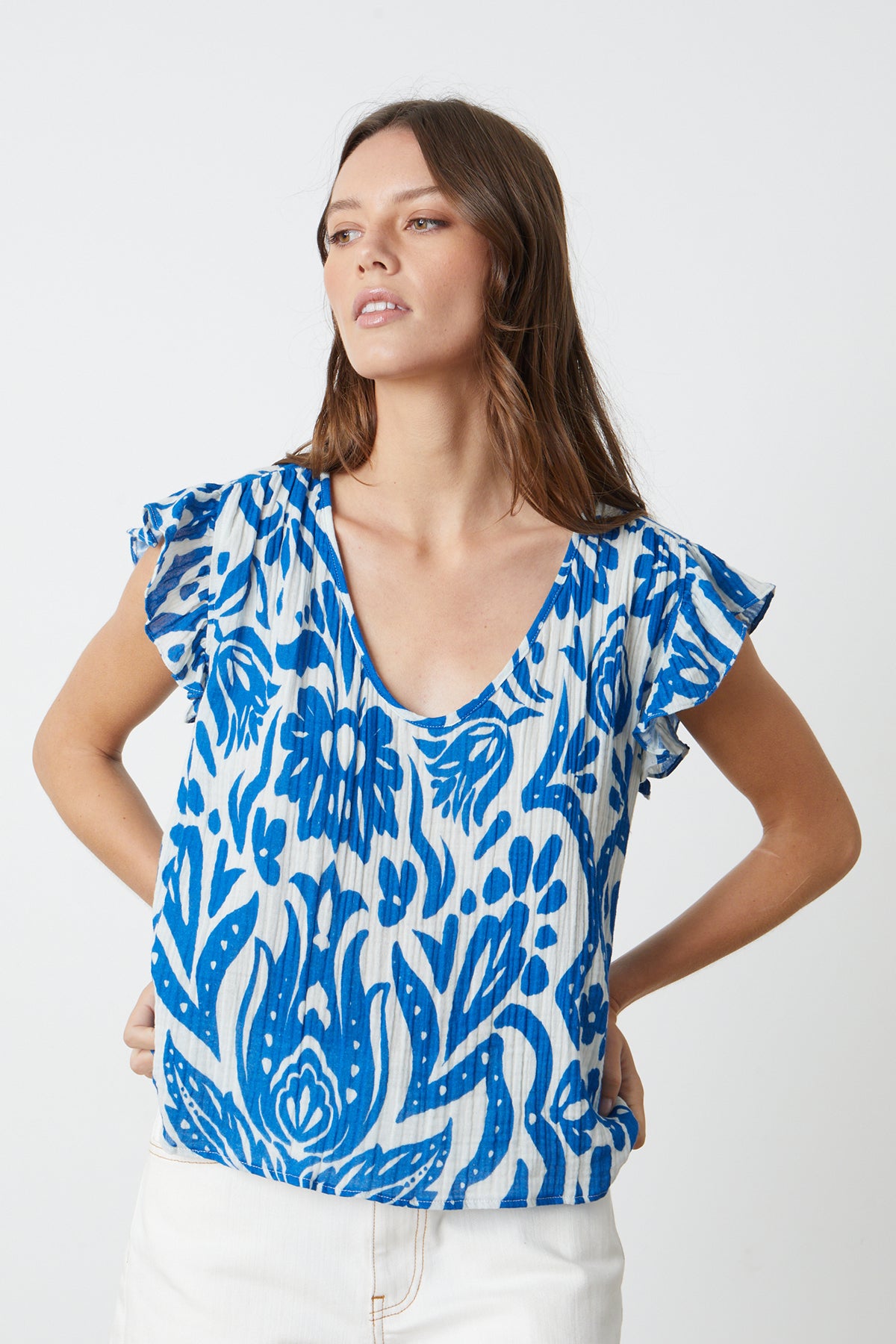 a model wearing the Velvet by Graham & Spencer ALEAH PRINTED COTTON GAUZE top.-26342683377857