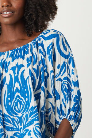 A woman wearing a Velvet by Graham & Spencer CANDICE PRINTED COTTON GAUZE TOP
