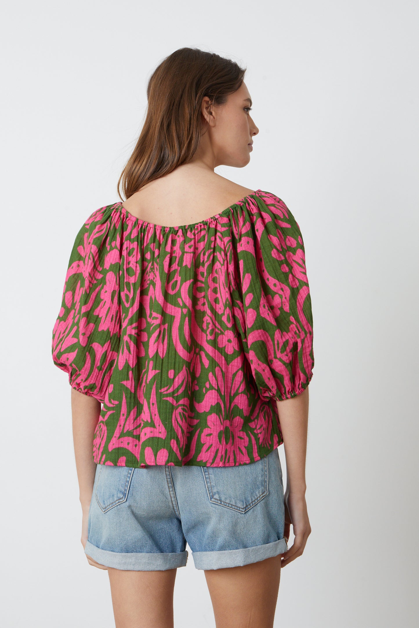 The back view of a woman wearing a CANDICE PRINTED COTTON GAUZE TOP by Velvet by Graham & Spencer.-26577386700993