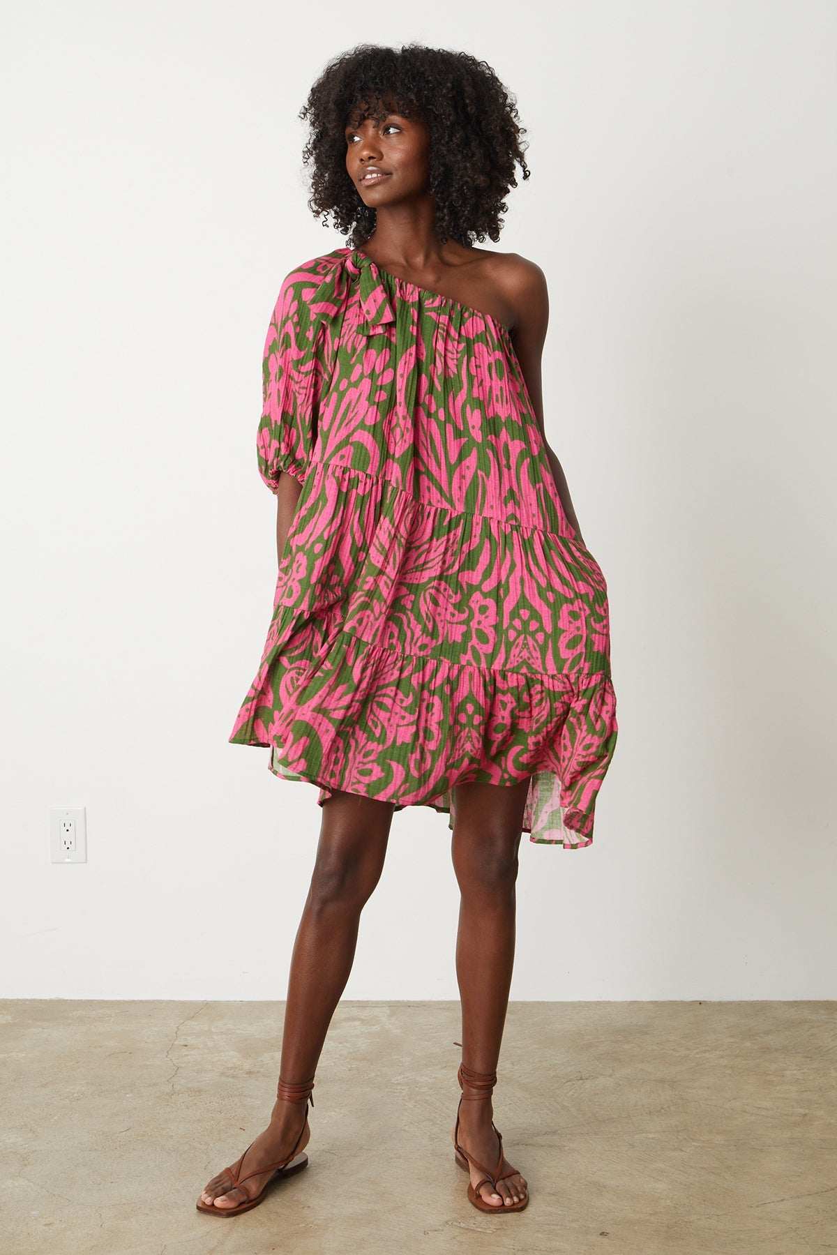a woman wearing the Velvet by Graham & Spencer GRETCHEN PRINTED ONE SHOULDER DRESS.-26801042161857