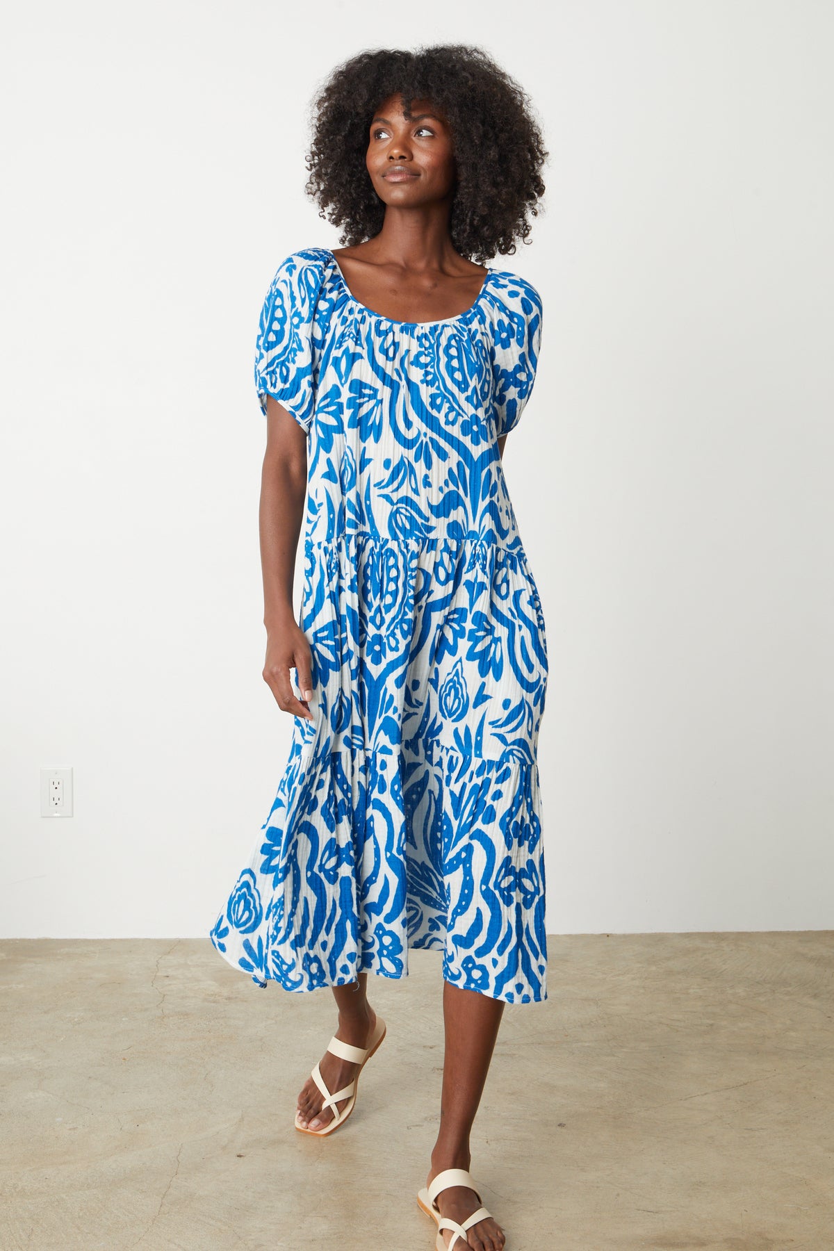 A woman wearing a Velvet by Graham & Spencer MADILYN PRINTED COTTON GAUZE MIDI DRESS.-35205229150401
