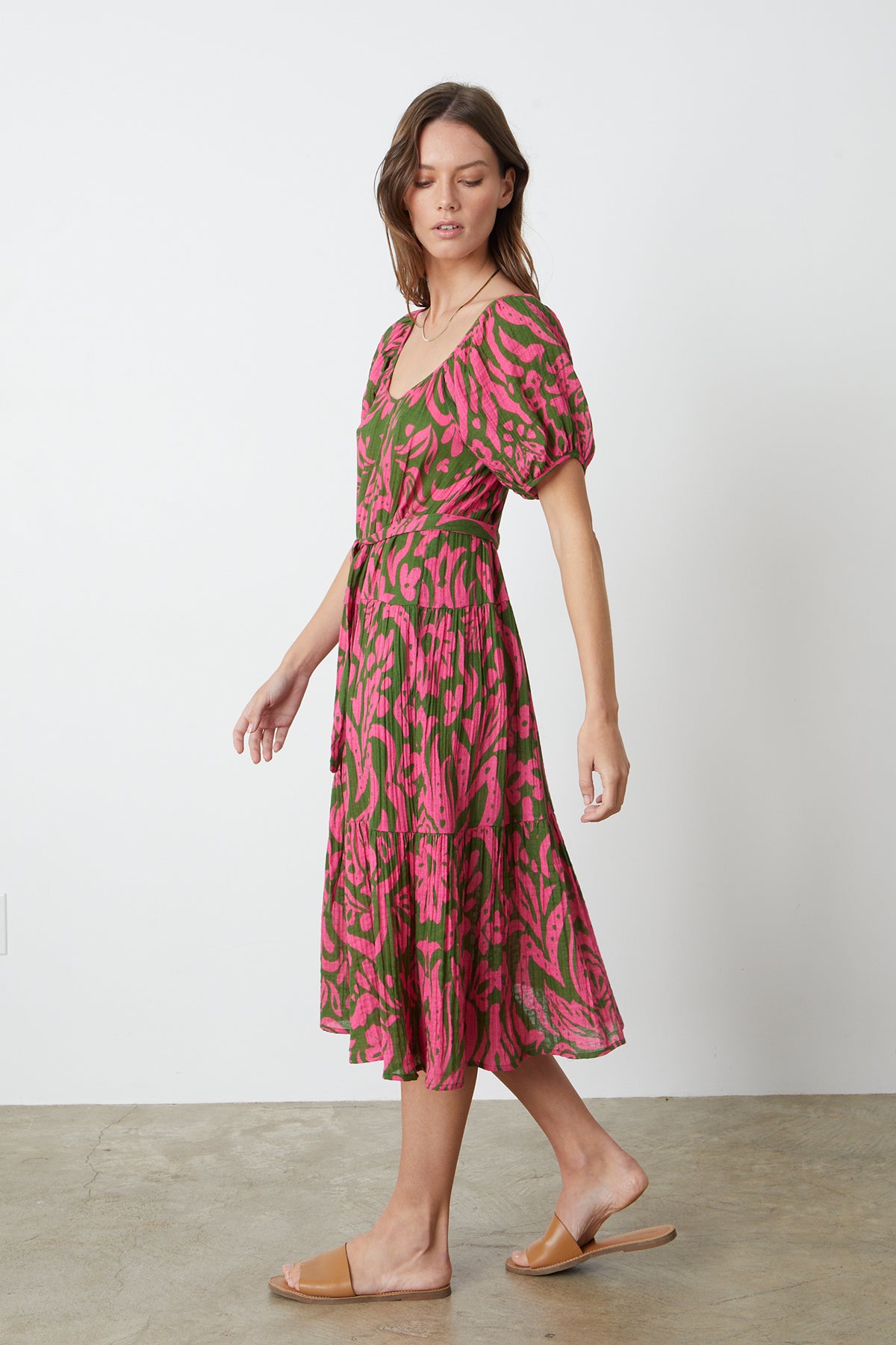 The model is wearing a Velvet by Graham & Spencer MADILYN PRINTED COTTON GAUZE MIDI DRESS in pink and green.-26342678364353