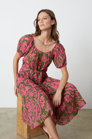 The model is wearing the Velvet by Graham & Spencer MADILYN PRINTED COTTON GAUZE MIDI Dress.