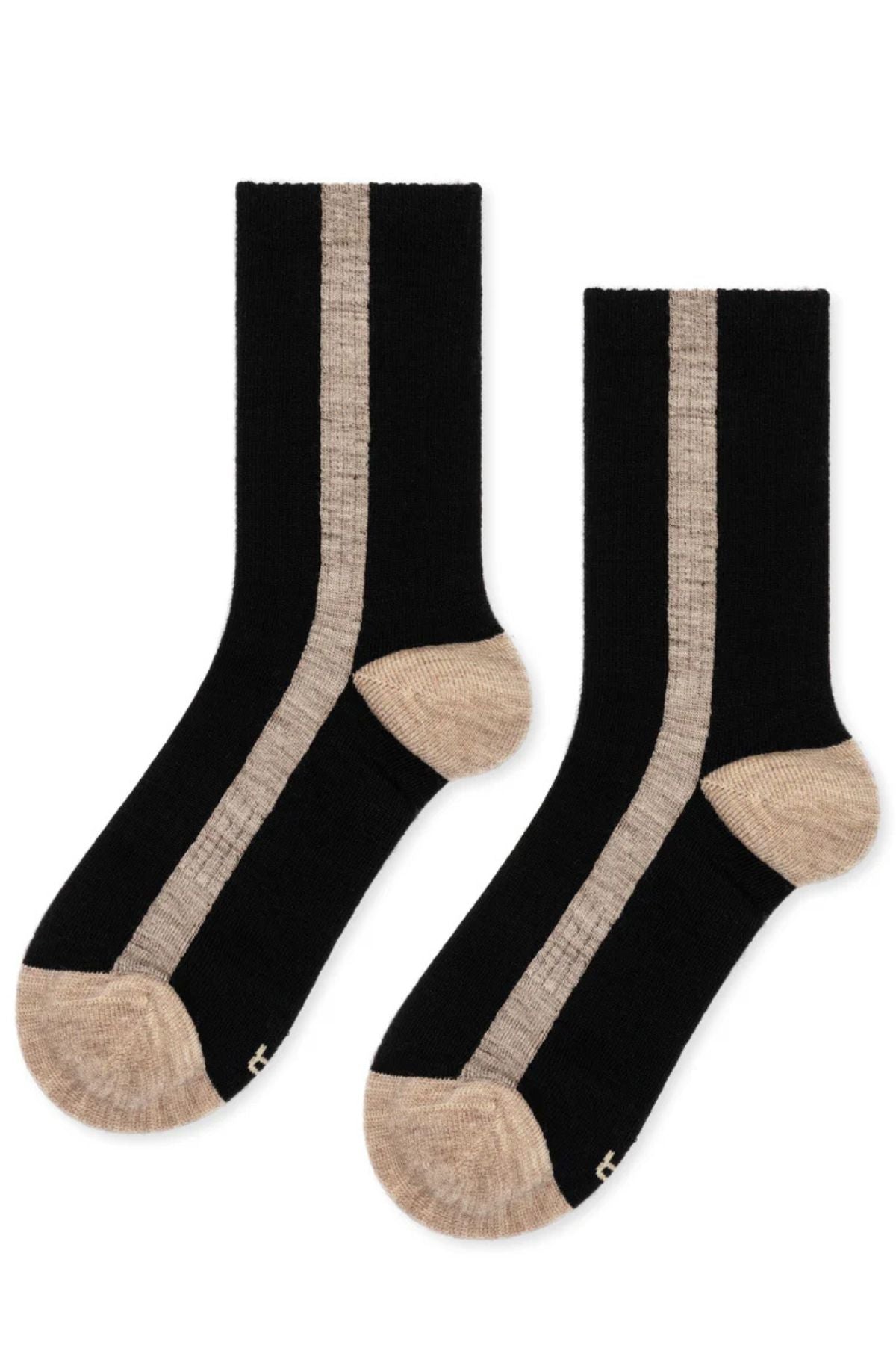 The TUXEDO STRIPE ATHLETIC WOOL CREW SOCK by Hansel From Basel features black fabric with beige toes, heels, and vertical side stripes.