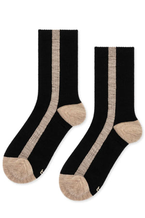 The TUXEDO STRIPE ATHLETIC WOOL CREW SOCK by Hansel From Basel features black fabric with beige toes, heels, and vertical side stripes.