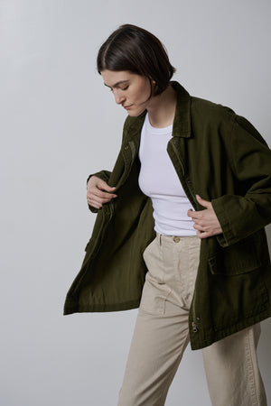 A woman wearing a OAKLEY JACKET made by Velvet by Jenny Graham, made of cotton twill fabric.