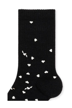 The IMI Athletic Wool Crew Socks by Hansel From Basel feature a black design with a scattered pattern of small white hearts.