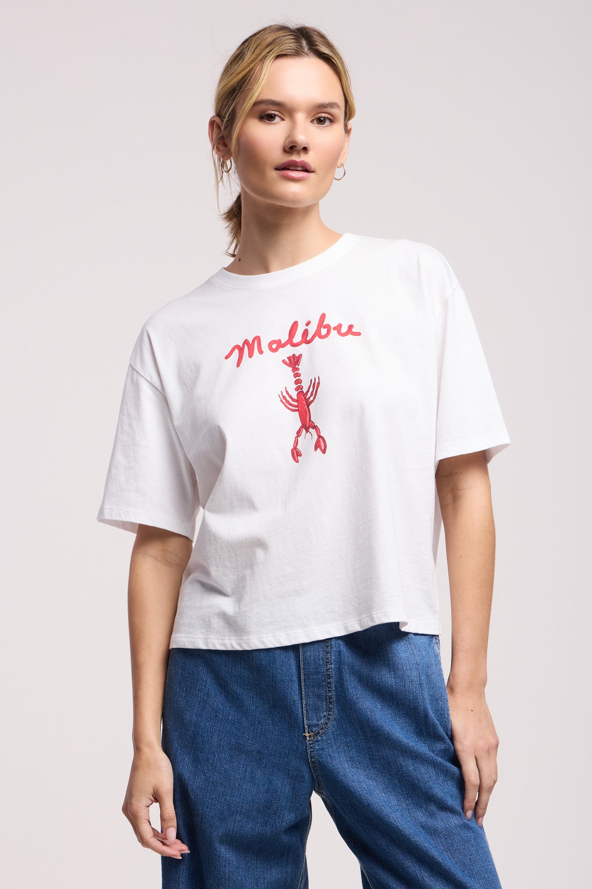 A person wears the SAMMY TEE by Velvet by Graham & Spencer—a relaxed California cotton jersey tee with 
