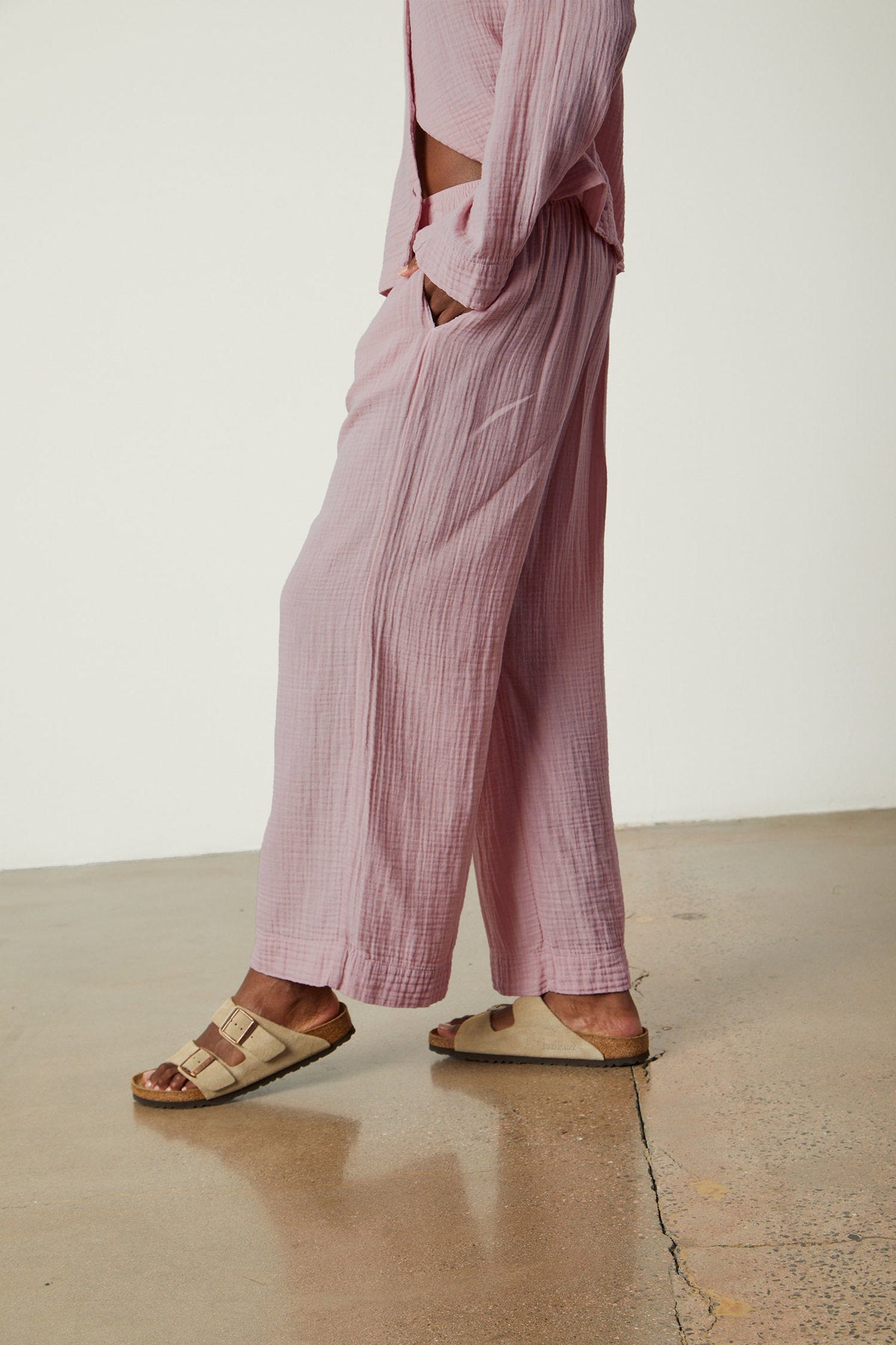   a woman wearing pink Jenny Graham Home PAJAMA PANT and sandals. 