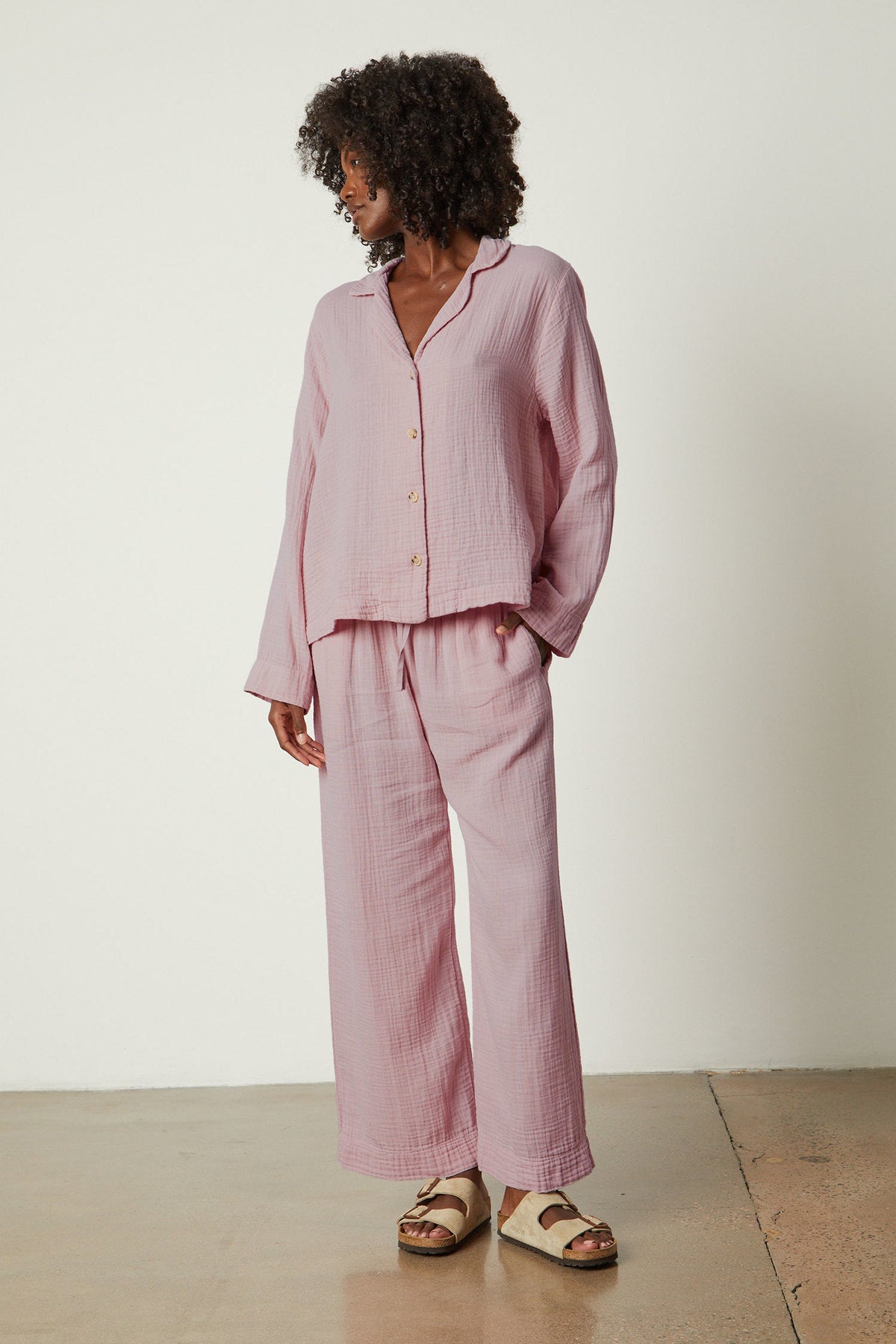 The model is wearing a pink linen Jenny Graham Home PAJAMA PANT set.-26311382696129