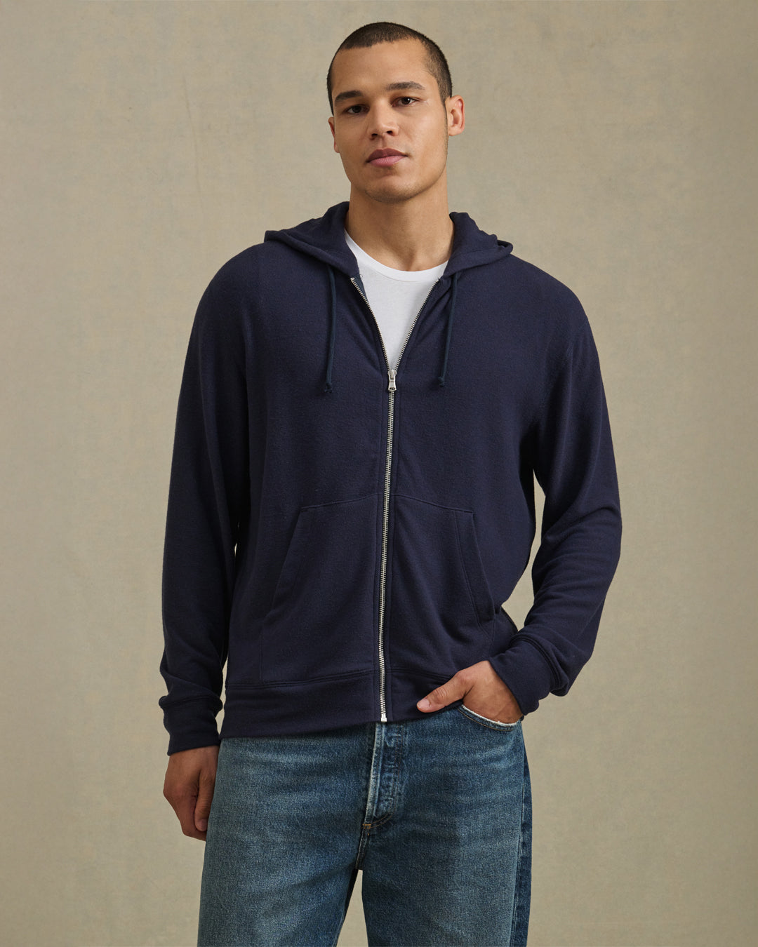 A man wearing the Porter Hoodie by Velvet by Graham & Spencer.