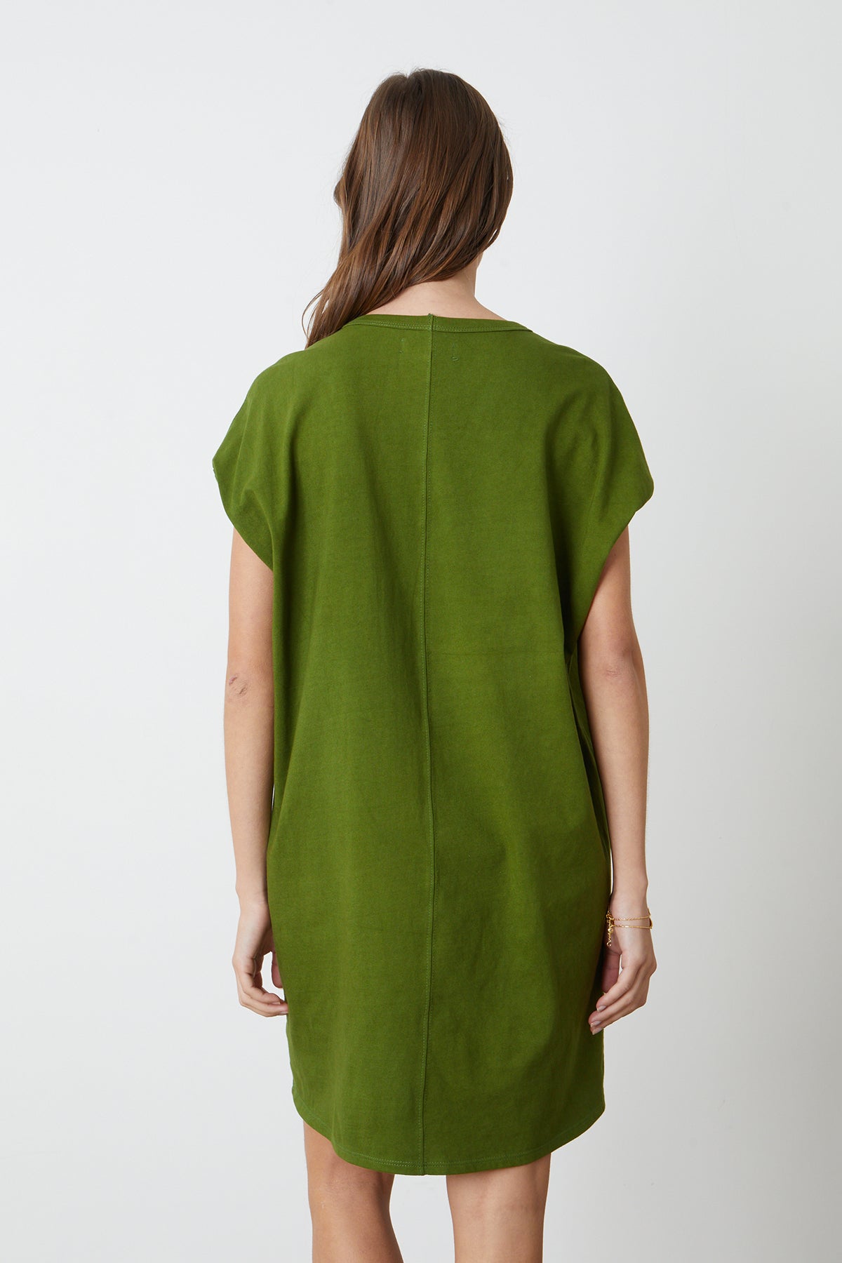 The back view of a woman wearing a green Velvet by Graham & Spencer Cassidy Crew Neck Dress.-26342692716737