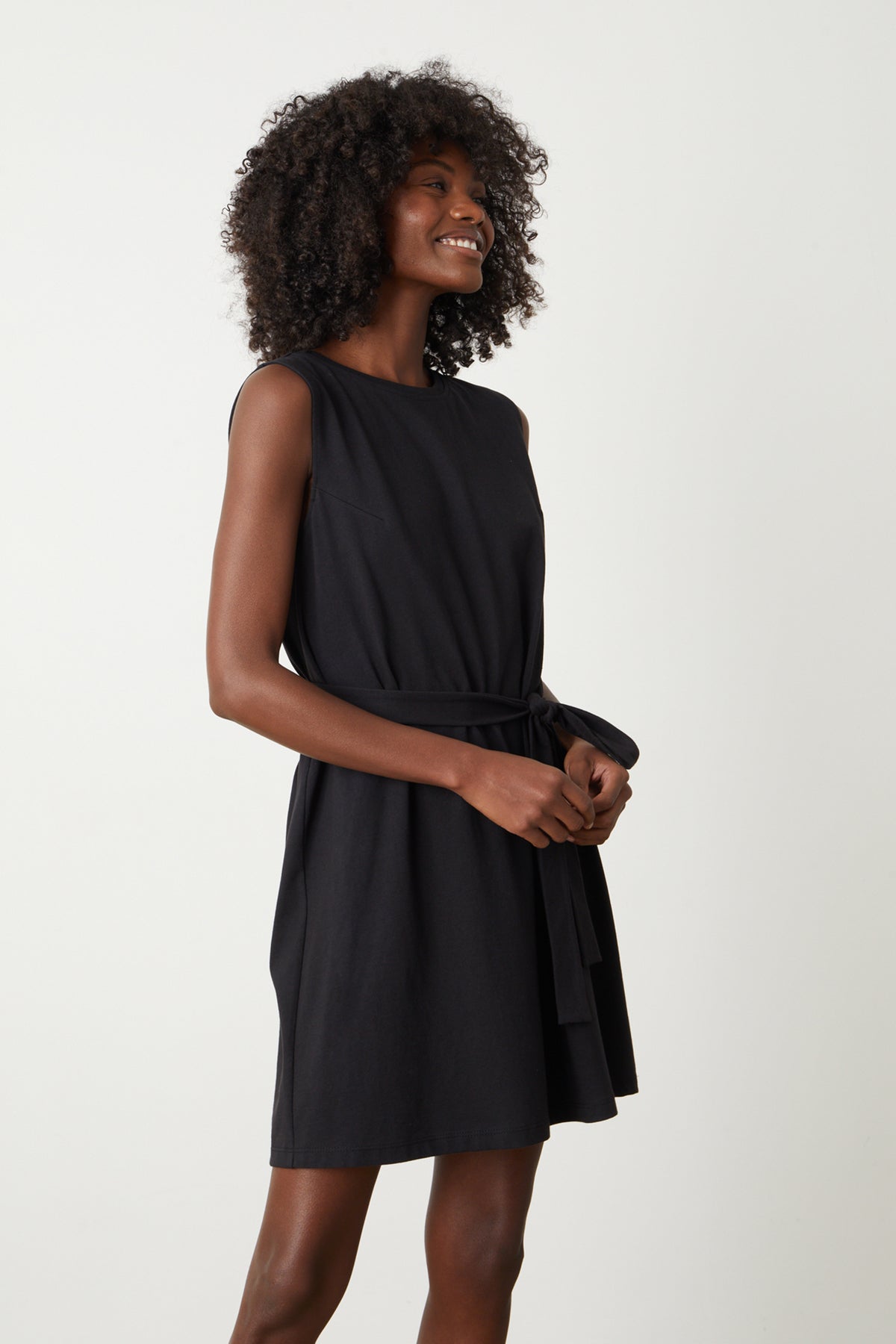 a woman wearing a Velvet by Graham & Spencer LAINE STRUCTURED TANK DRESS with a belt.-26544326508737