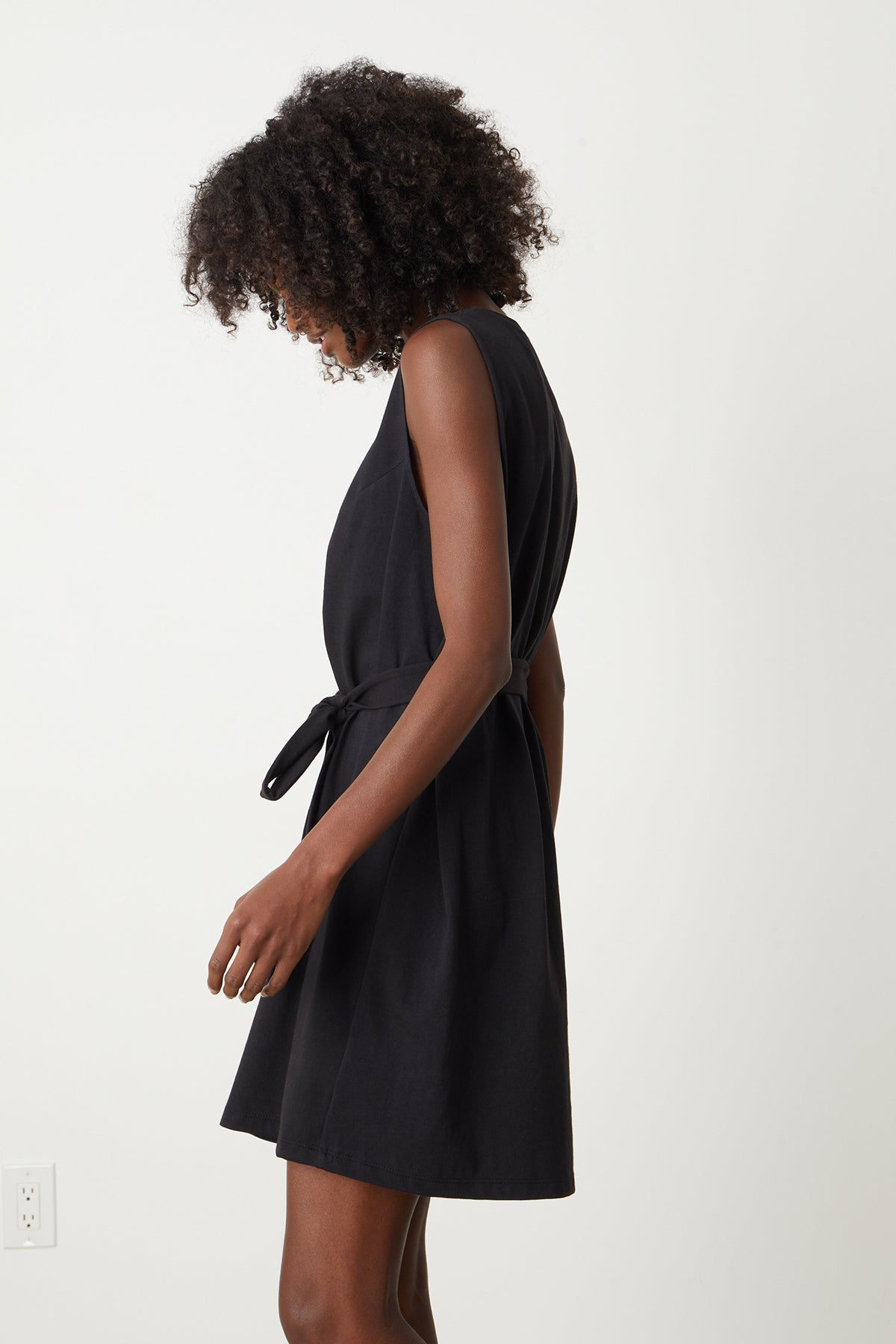 a woman wearing a Velvet by Graham & Spencer LAINE STRUCTURED TANK DRESS with a belt.-26342718636225
