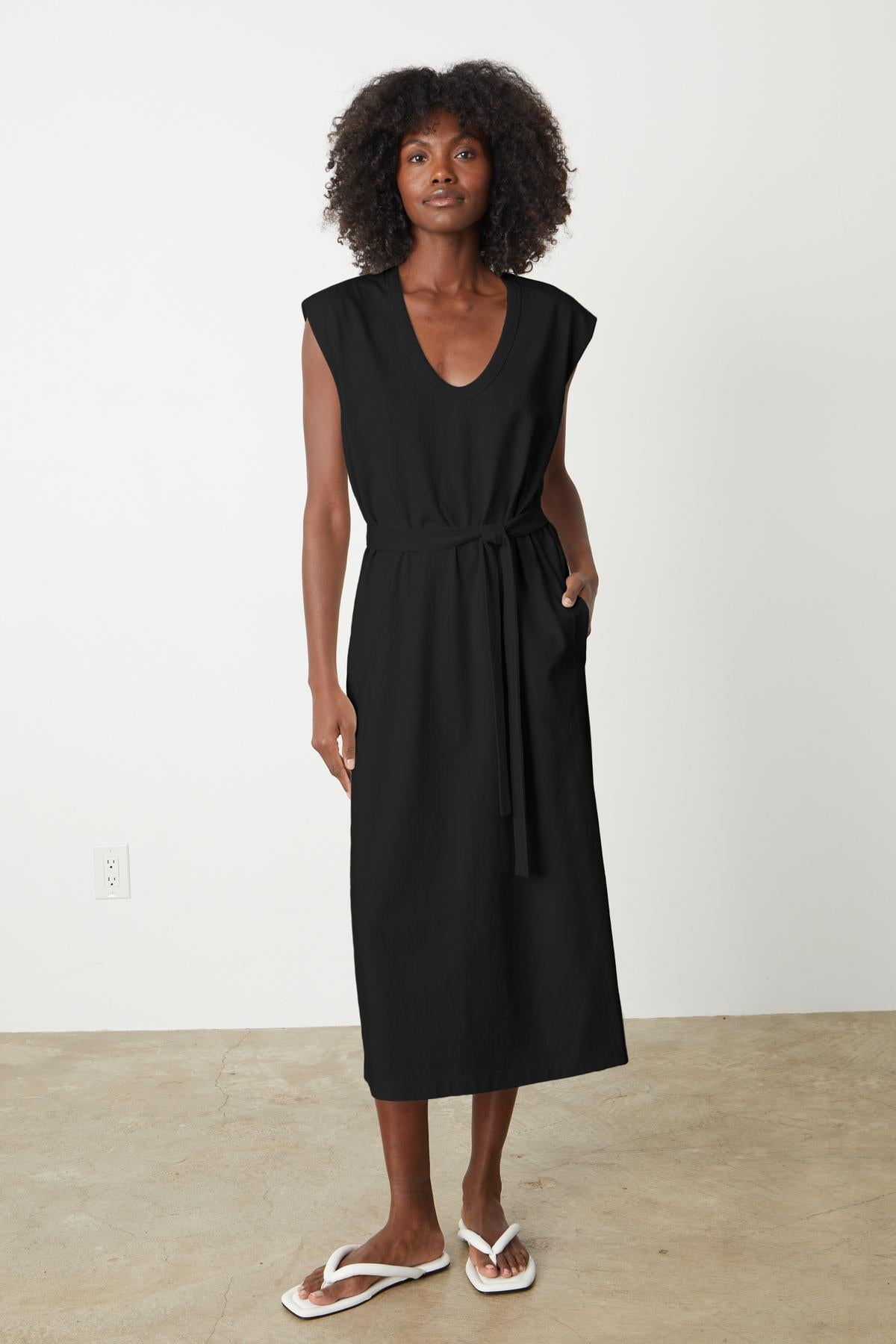 A versatile woman wearing a Velvet by Graham & Spencer MACI SCOOP NECK DRESS.-35201180336321