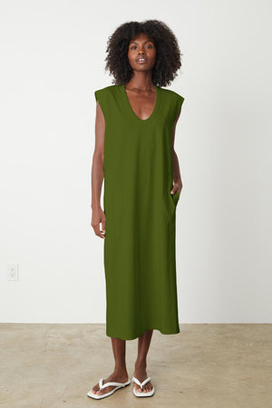 A woman wearing a structured cotton MACI SCOOP NECK DRESS by Velvet by Graham & Spencer showcasing versatility.