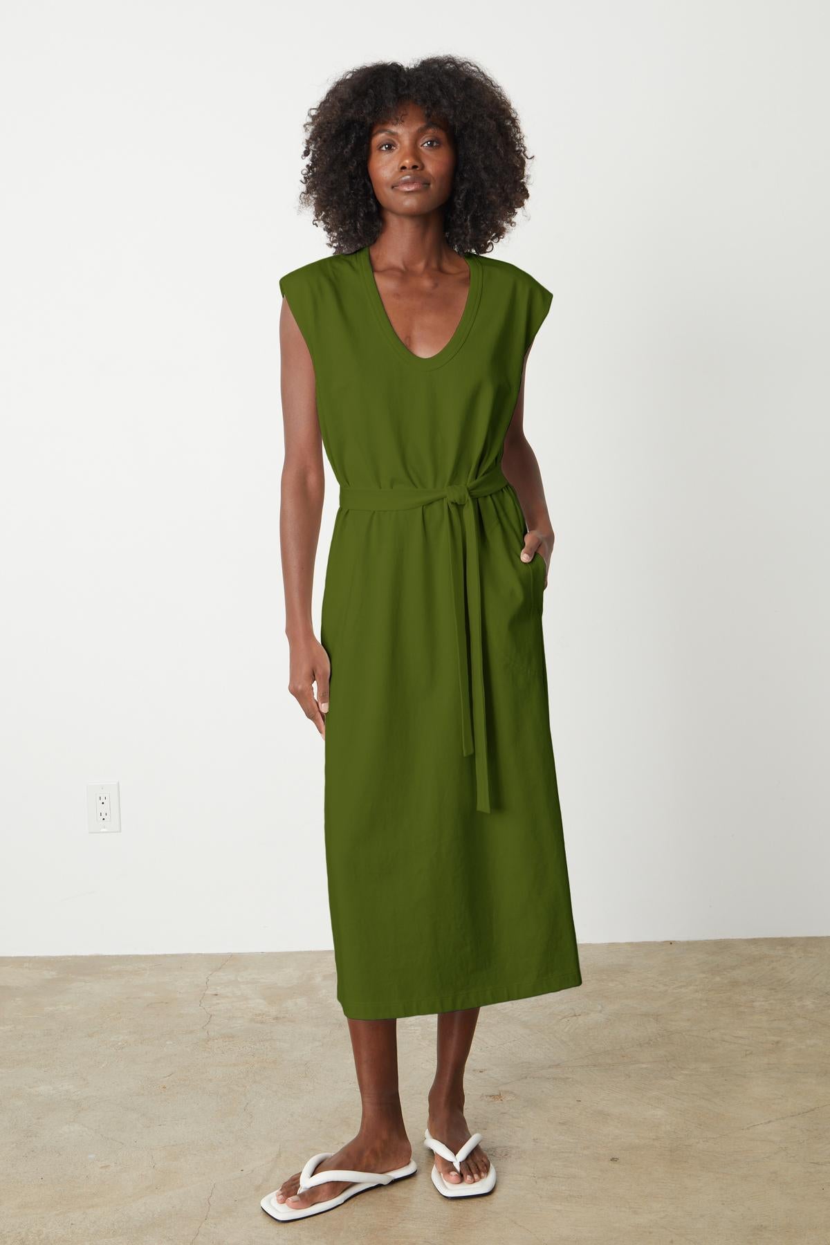 A woman wearing a Velvet by Graham & Spencer structured cotton MACI SCOOP NECK DRESS with flip flops.-35201180434625