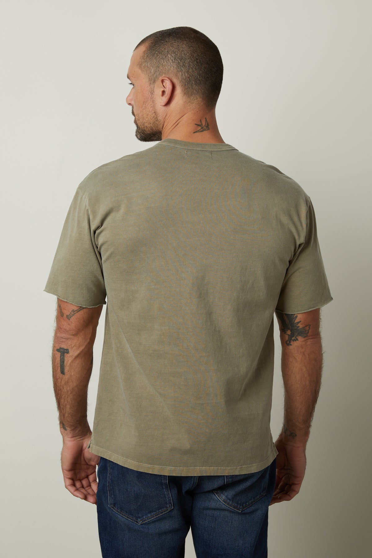   The back view of a man wearing a Velvet by Graham & Spencer NEPTUNE CREW NECK POCKET TEE. 