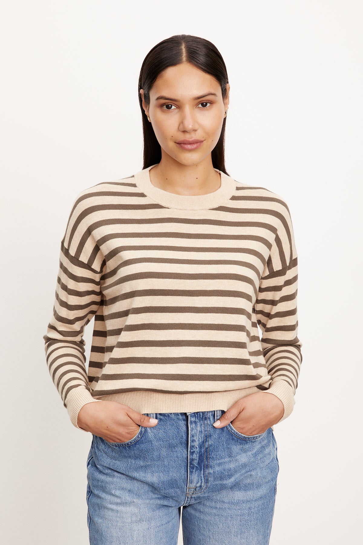 The model is wearing the ALISTER STRIPED CREW NECK SWEATER by Velvet by Graham & Spencer.-26799863365825
