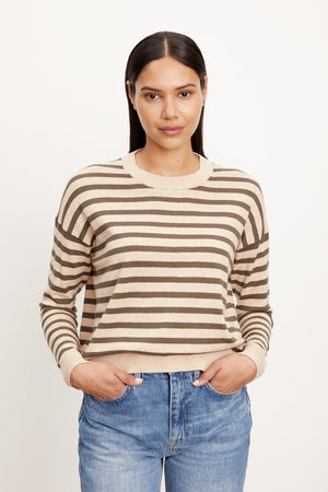 The model is wearing the ALISTER STRIPED CREW NECK SWEATER by Velvet by Graham & Spencer.