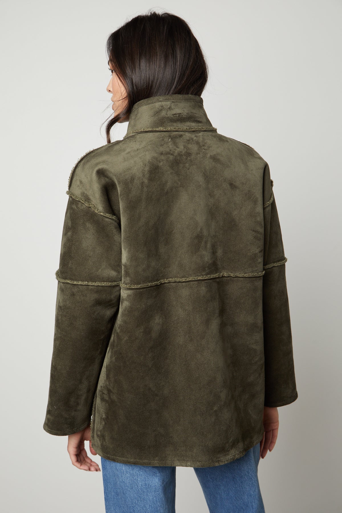   The back view of a woman wearing the Velvet by Graham & Spencer ALBANY LUX SHERPA REVERSIBLE JACKET. 