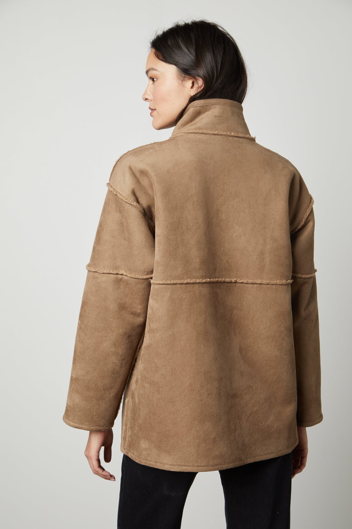 The back view of a woman wearing a Velvet by Graham & Spencer ALBANY LUX SHERPA REVERSIBLE JACKET.-35782611763393