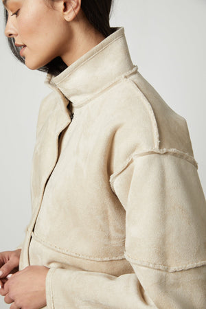 The model is wearing an Albany Lux Sherpa Reversible Jacket by Velvet by Graham & Spencer, perfect for layering.