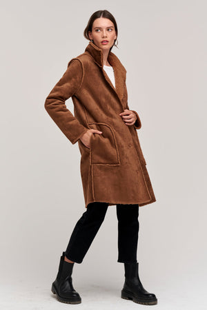 Mirabel Faux Lux Sherpa Reversible Coat in roast brown reversed with Victoria black denim and black boots side