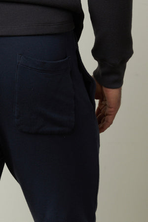 The back view of a man wearing Velvet by Graham & Spencer's CROSBY LUXE FLEECE JOGGER for workouts.