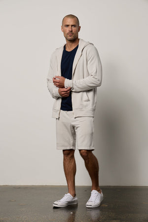 A modern fabrication of a RODAN LUXE FLEECE ZIP HOODIE with shorts, perfect for gym-class or casual wear. (Brand Name: Velvet by Graham & Spencer)