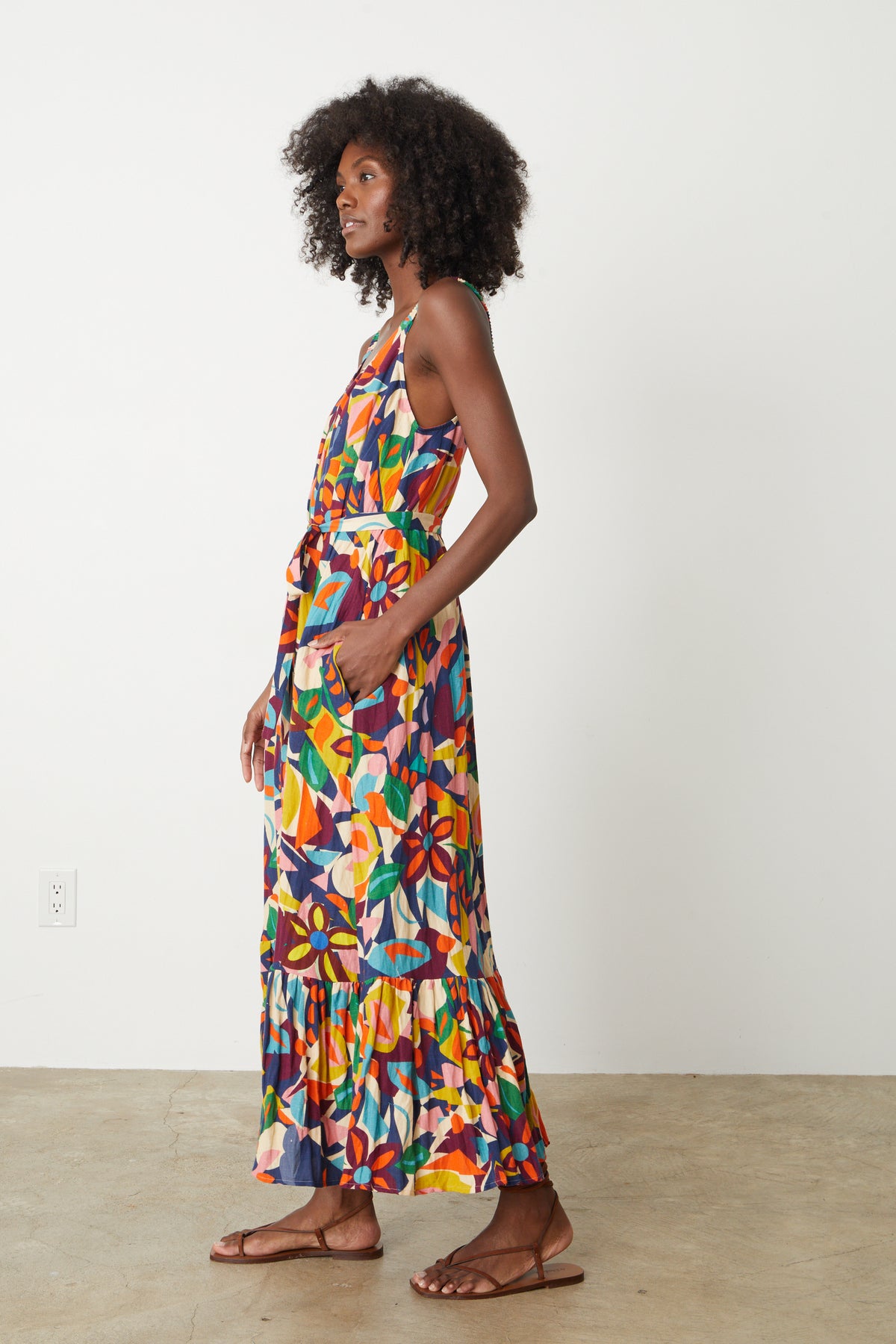 A woman wearing a colorful Velvet by Graham & Spencer Estelle Printed Linen Dress.-26774841721025