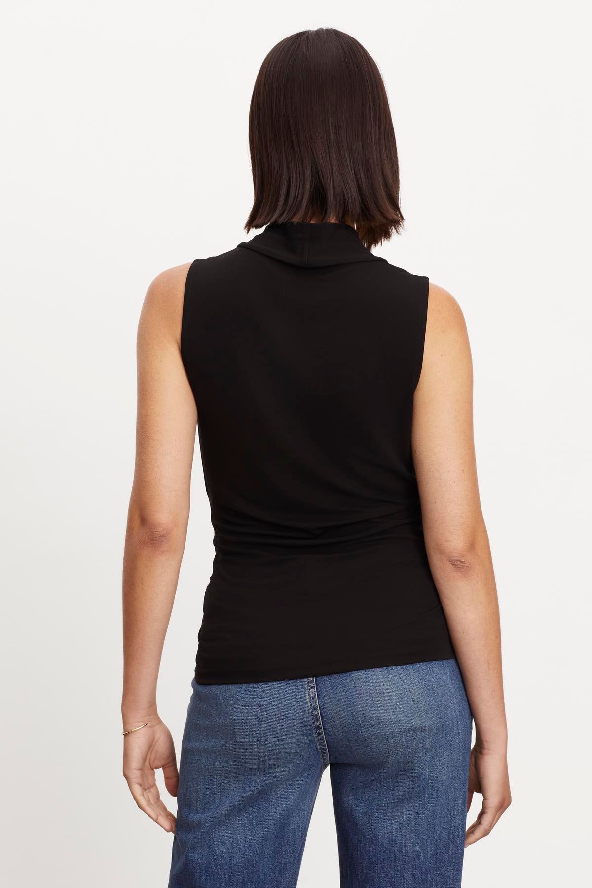   The view of a woman wearing a Velvet by Graham & Spencer DORTHY WRAP TANK TOP. 
