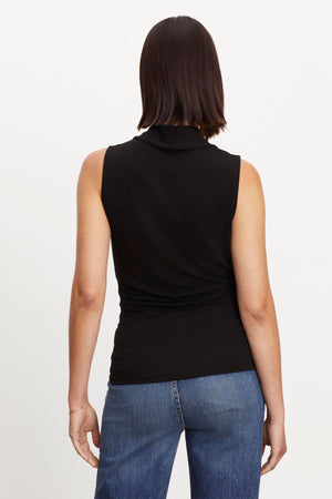 The view of a woman wearing a Velvet by Graham & Spencer DORTHY WRAP TANK TOP.