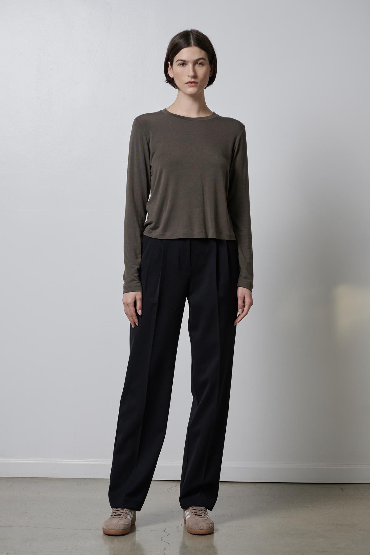 The model is wearing a Velvet by Jenny Graham PACIFICA TEE and soft hand black trousers.-35495907885249