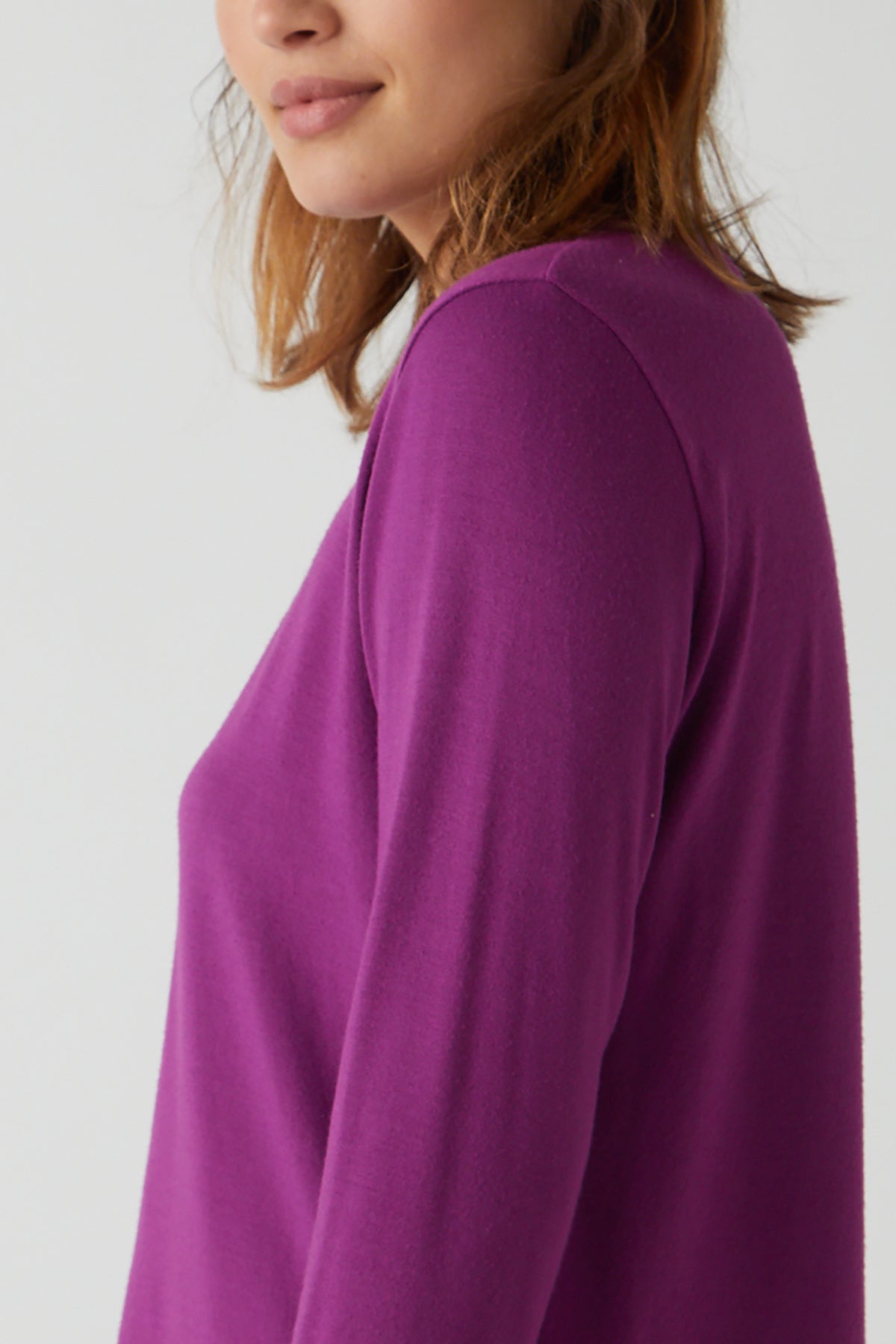The stretchy back view of a woman wearing a Velvet by Jenny Graham PACIFICA TEE.-26413774012609