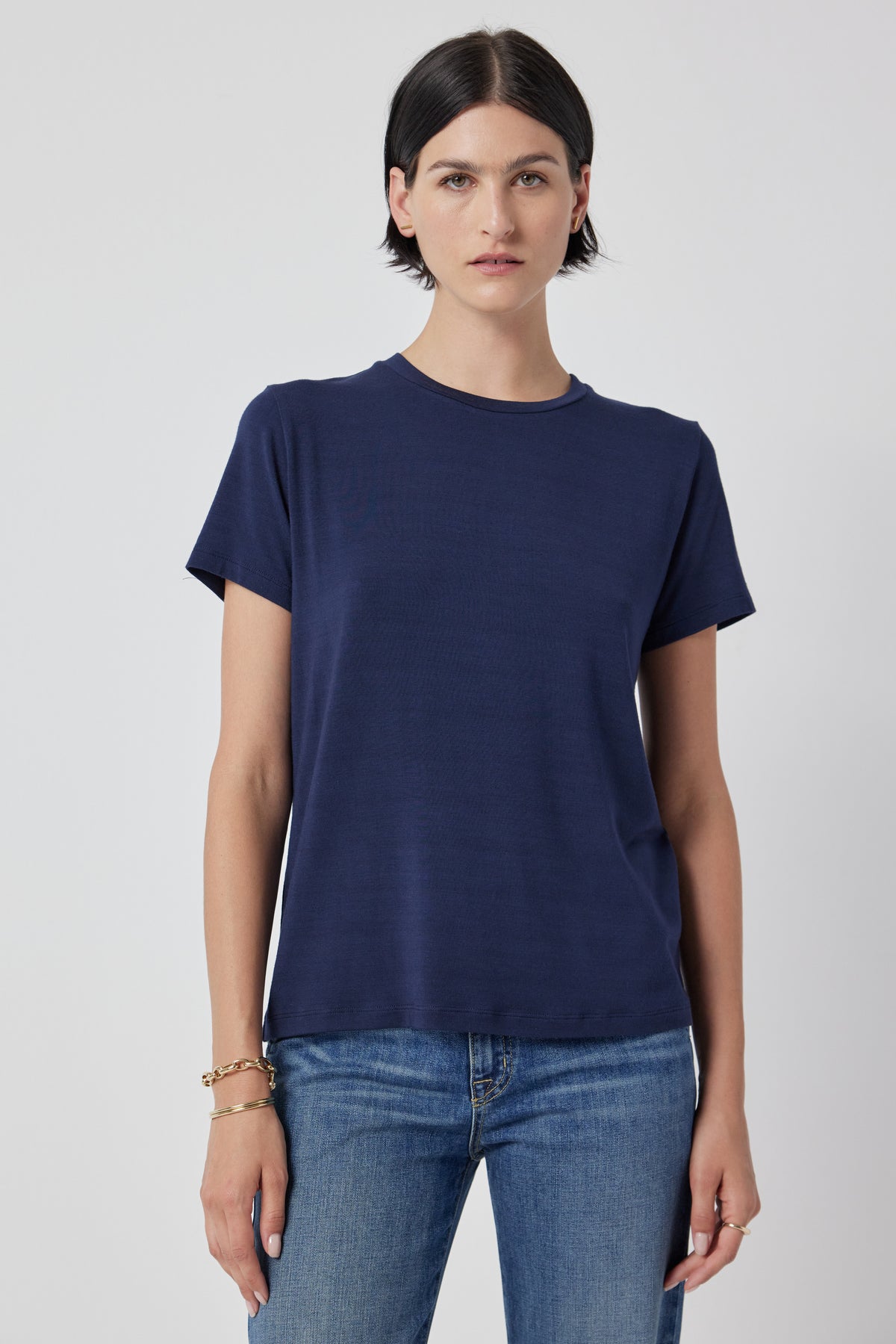   Woman wearing a SOLANA TEE by Velvet by Jenny Graham and jeans. 