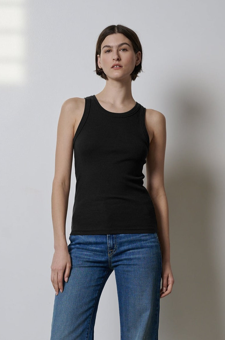A woman wearing a CRUZ tank top by Velvet by Jenny Graham and jeans fits perfectly.-35417027772609