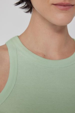 A close up of a woman wearing a Velvet by Jenny Graham CRUZ tank top.